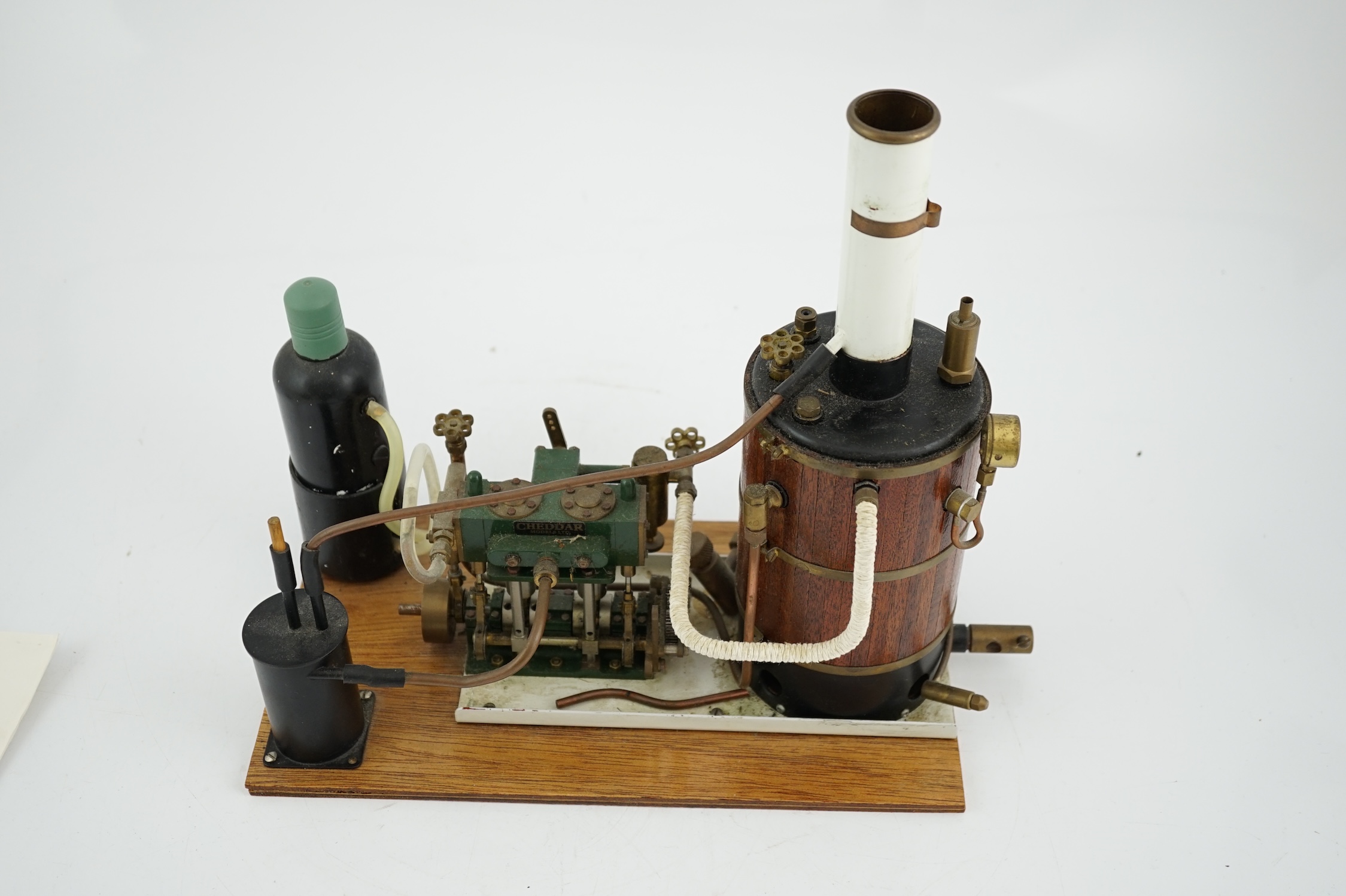 A Cheddar Models Ltd. Proteus steam plant, a gas fired vertical boiler two cylinder marine engine, with a wood clad copper boiler fitted with pressure gauge, water sight glass and safety valve